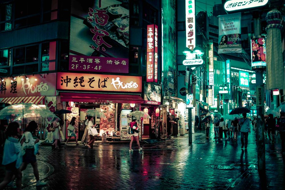 A city in Japan during the rain representing 20 Things to Know About Japan According to Travel Bloggers