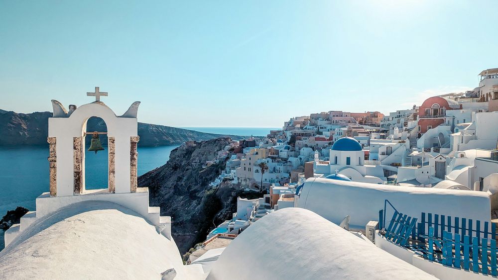 White roofs in Santorini, Greece one of the Affordable Romantic Getaways in Europe