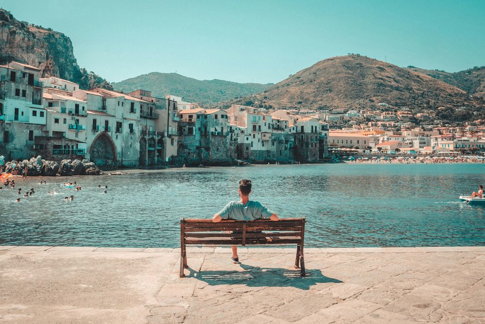 Man overlooking Cefalù in The 15 Best Things To Do in Sicily