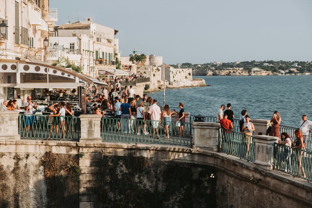 People in a street in Ortigia (Syracuse) The 15 Best Things To Do in Sicily