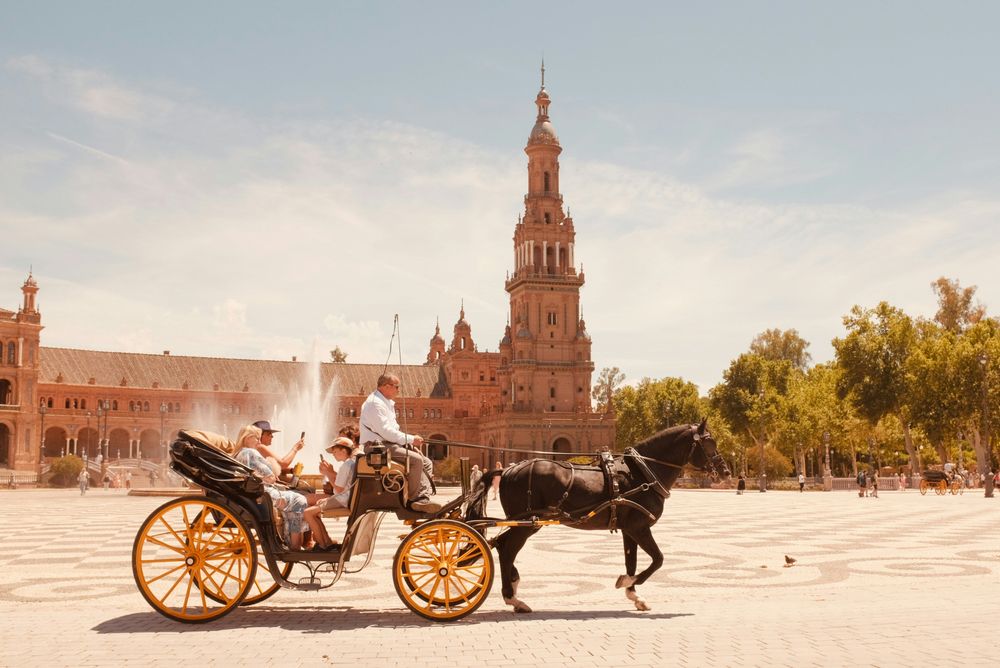 Couple in a Chariot in Seville, Spain one of the Affordable Romantic Getaways in Europe