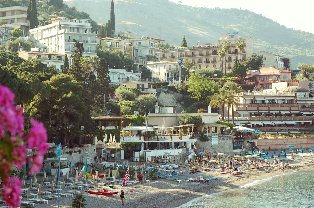 A hill and beach in Taormina in The 15 Best Things To Do in Sicily