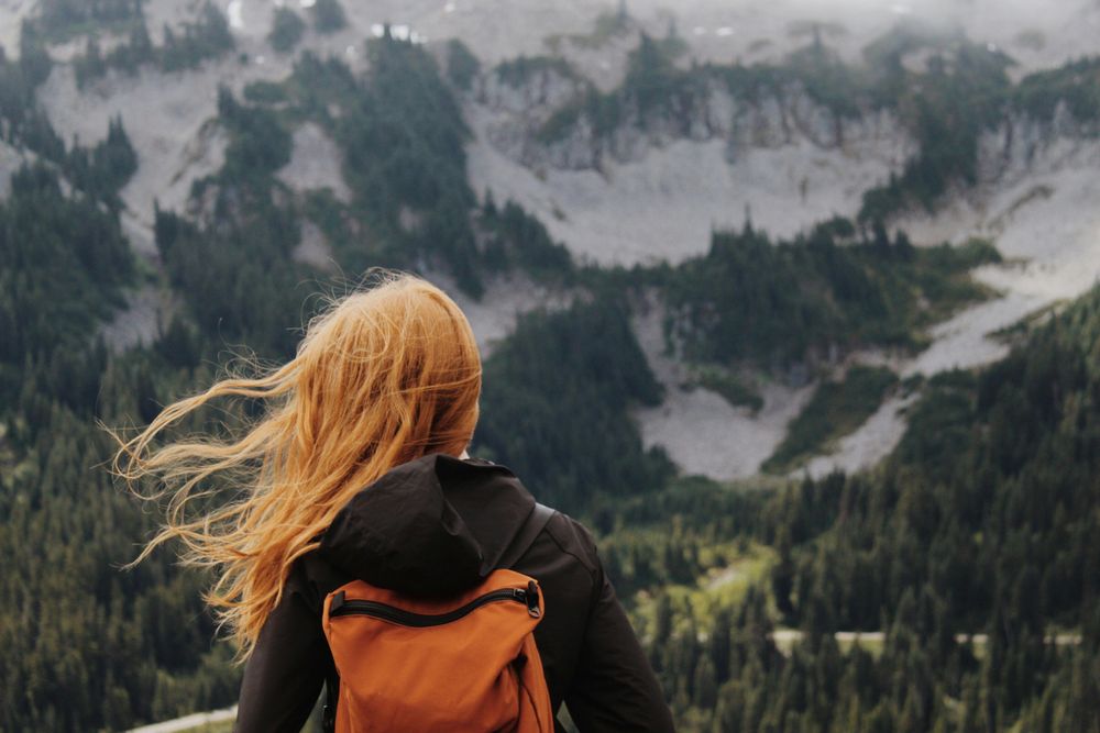 Travel Planning with the Help of AI, woman looking at the mountains