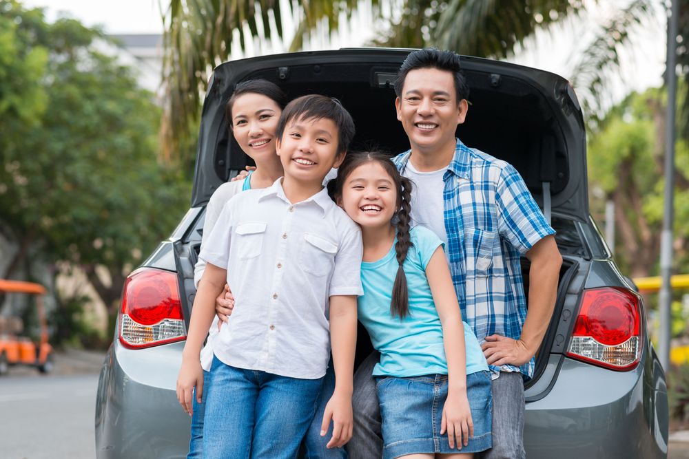 Family Travel Budget, a family smiling before traveling