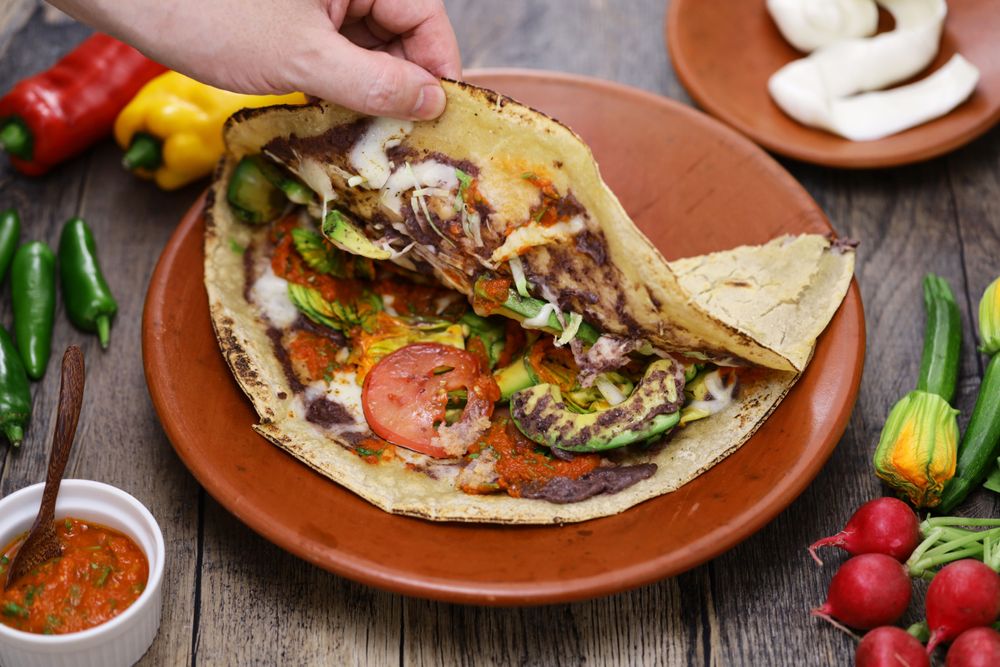 A Tlayuda representing Tlayudas Libres one of the Best Places to Eat in Oaxaca