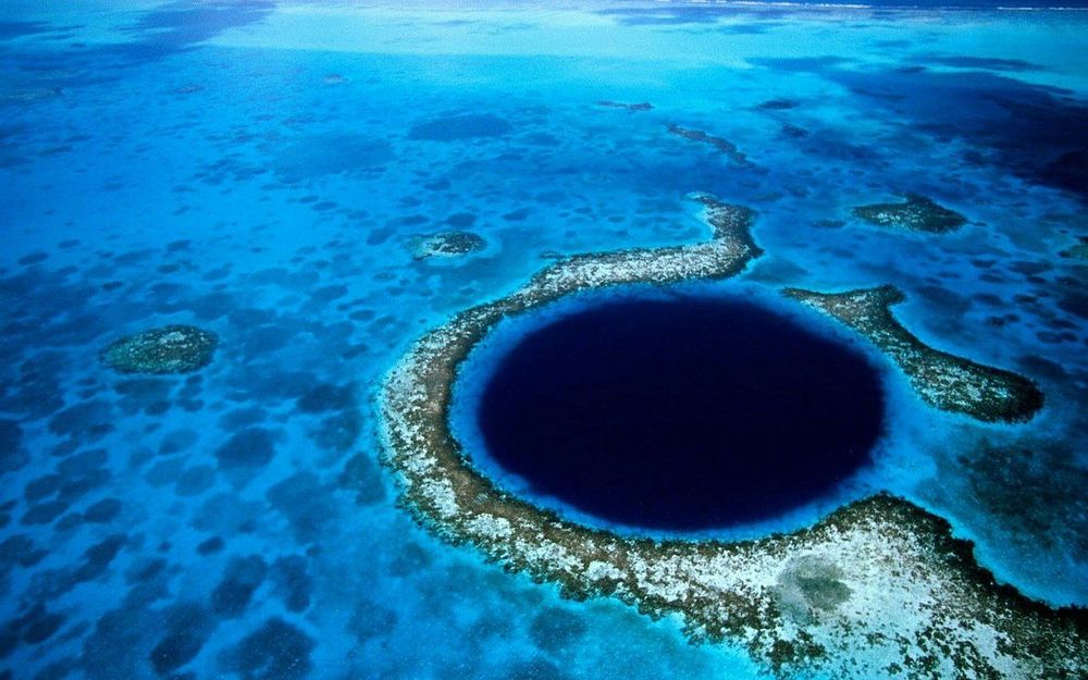 Unique places to see, aerial view of The Great Blue Hole, Belize