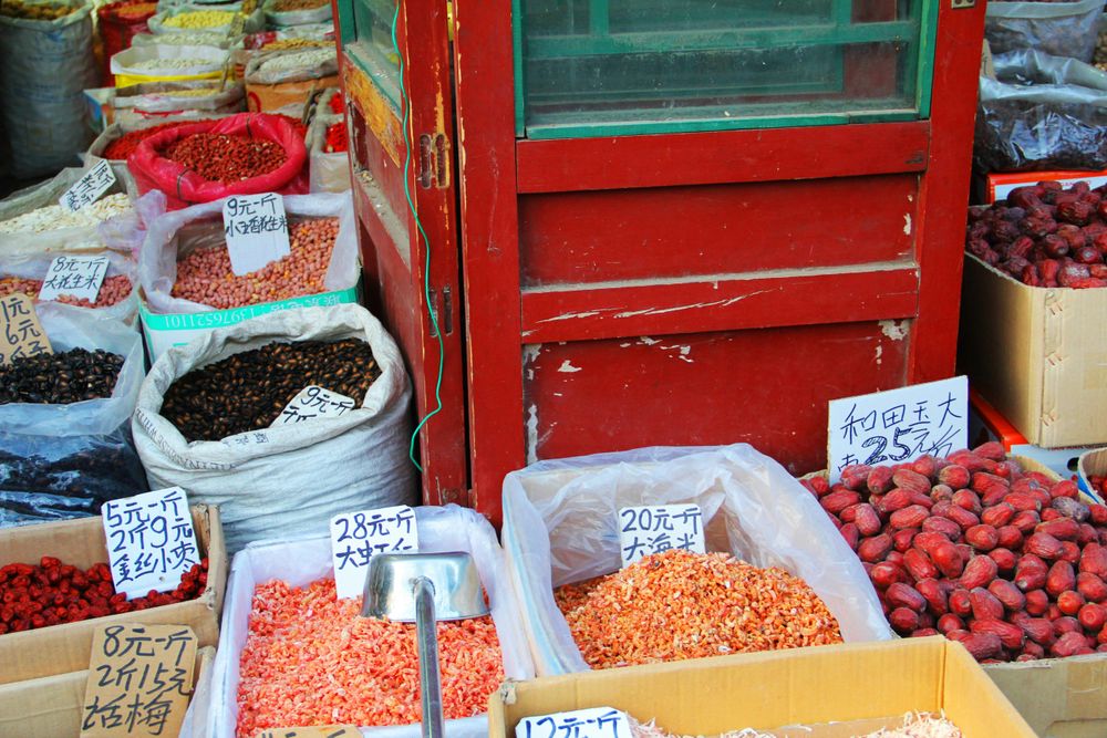 Spices in a market in China, representing Hacks to Save Money while traveling
