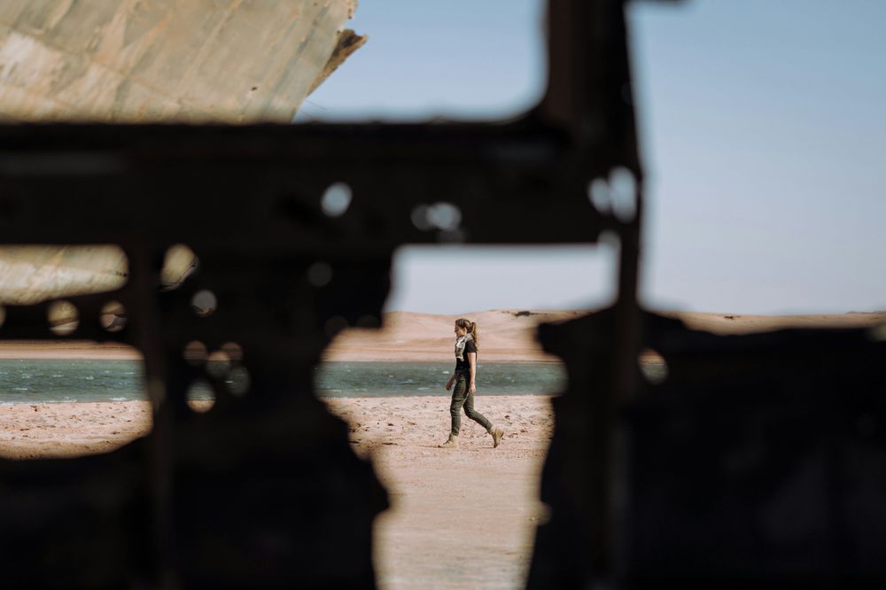 Woman walking alone, representing the cons of AI Travel