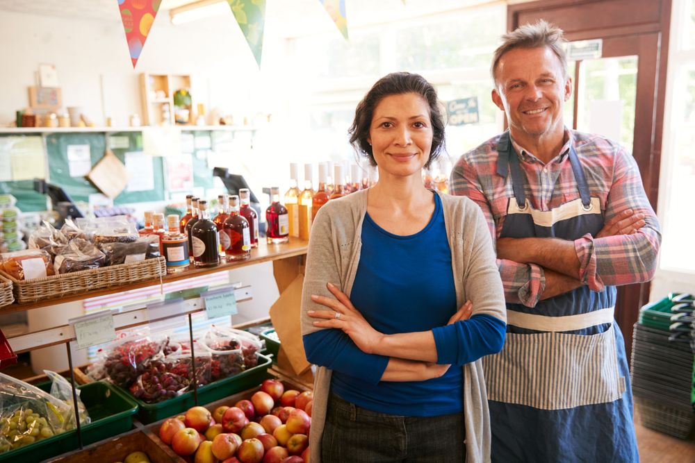 Couple running a farm shop in Support Local Economies in  Practising Responsible Tourism