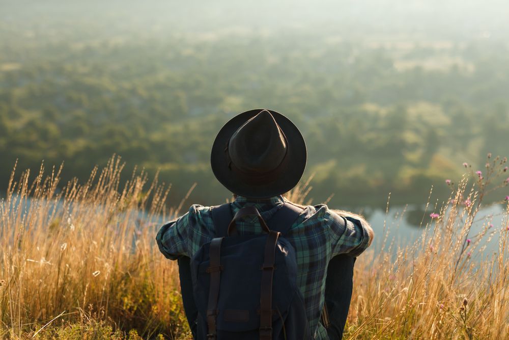 Man enjoying sunlight following a tip on how to avoid jet lag