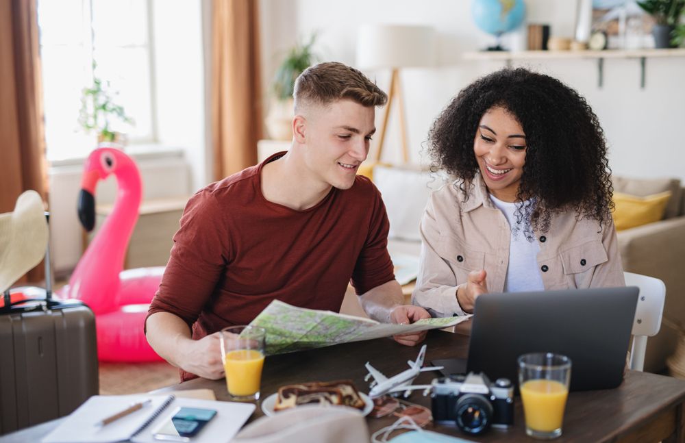 couple planning their travels on a computer, representing AI Travel Planner