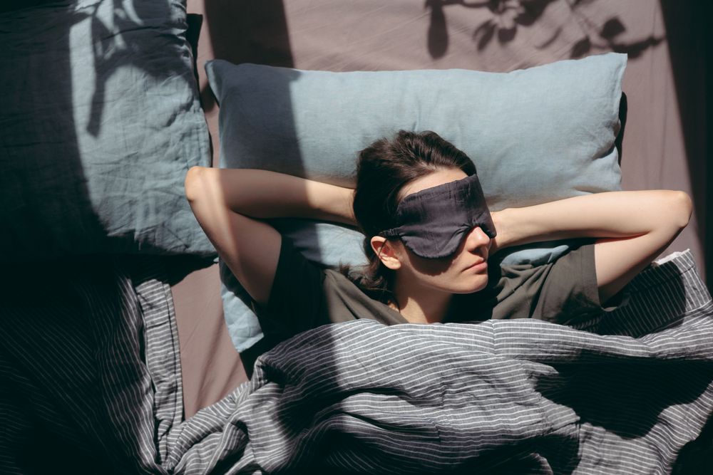 Woman taking a nap following a tip on how to avoid jet lag