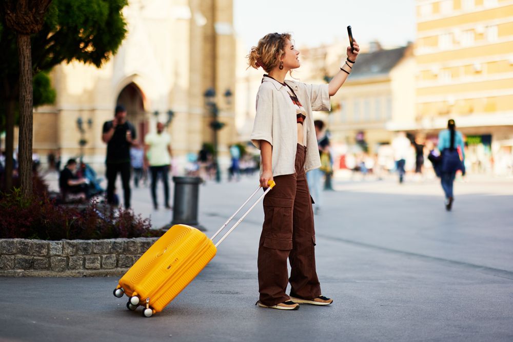 Tourist exploring a city using her phone because she has a good Travel eSIM