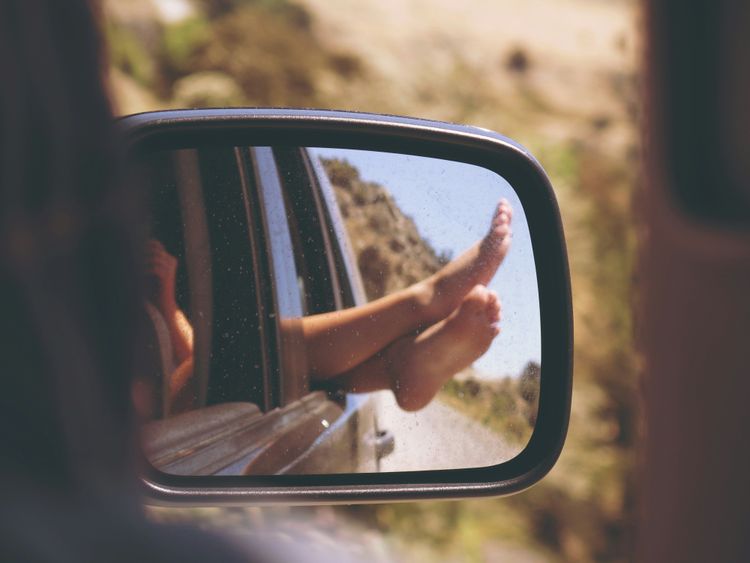 traveller on a car representing the stress free capabilities of Travel AI features