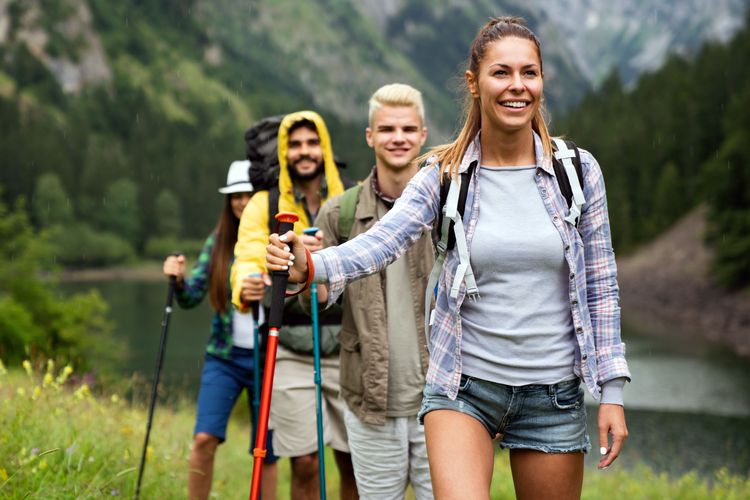 How to Make Friends While Traveling Solo, a group of young people hiking together